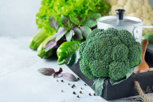 Preview: Concept of fresh broccoli green lettuce, cabbage, cucumber, dill, lime on a light background. Select