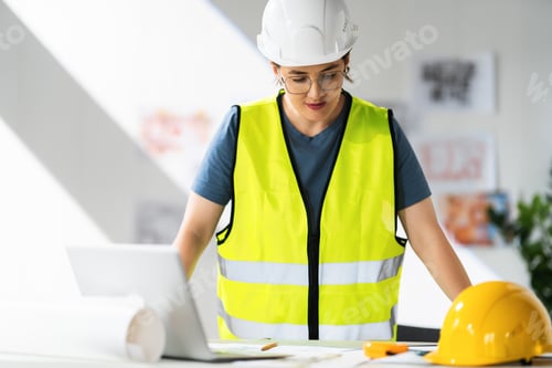 Preview: Woman architect is working on plans