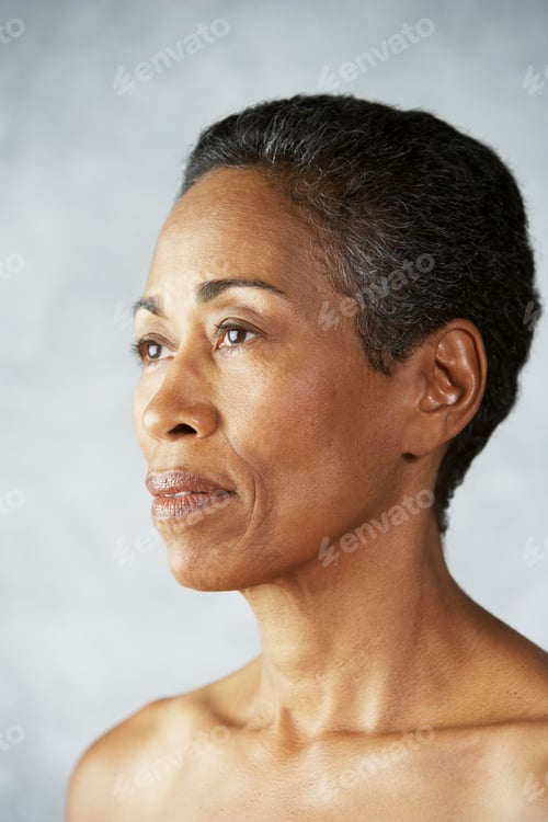Preview: A contemplative profile portrait of a mature woman