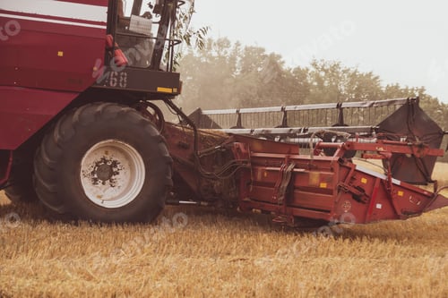 Preview: Combine harvester in the field. Close-up of a reel. Harvesting season. Rye and barley