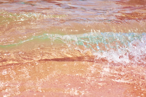 Preview: Sea wave on the sand beach, soft focus. Summer background