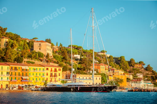 Preview: Sailing ship moored in the harbor with Porto Santo Stefano in the background