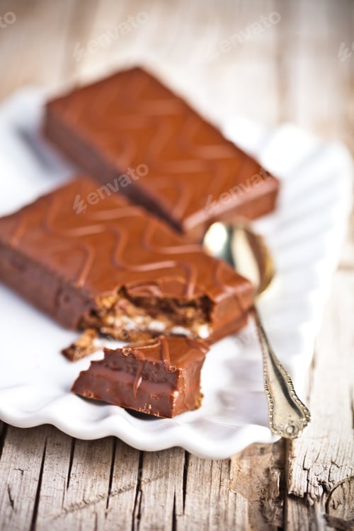 Preview: dark chocolate cakes and spoon on a plate