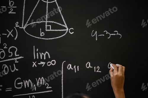 Preview: The hand that writes the formula with white chalk on the blackboard