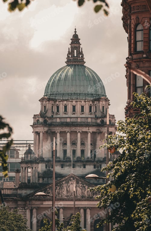 Preview: a dome building with a clock in front of it and people standing outside