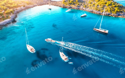 Preview: Aerial view of beautiful yachts and boats on the sea at sunset