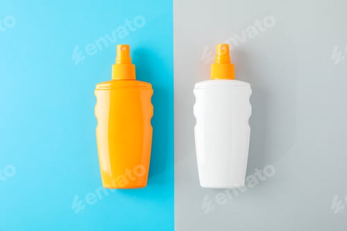 Preview: Composition with sunscreen sprays on two tone background. Space for text, top view