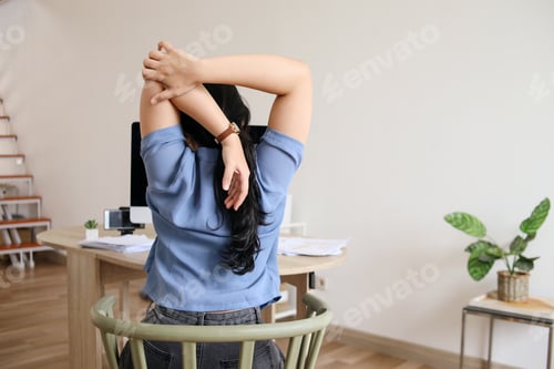 Preview: Stretching body at office