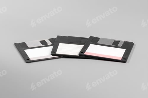 Preview: Three old computer diskette over grey background