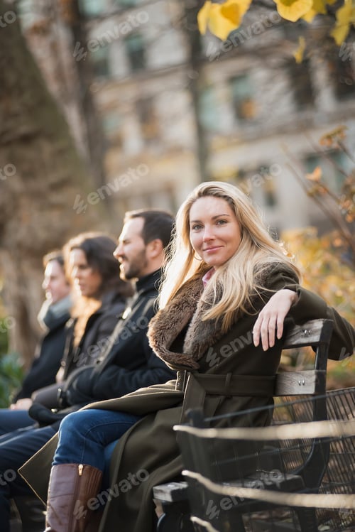 Preview: Business people on bench in urban park