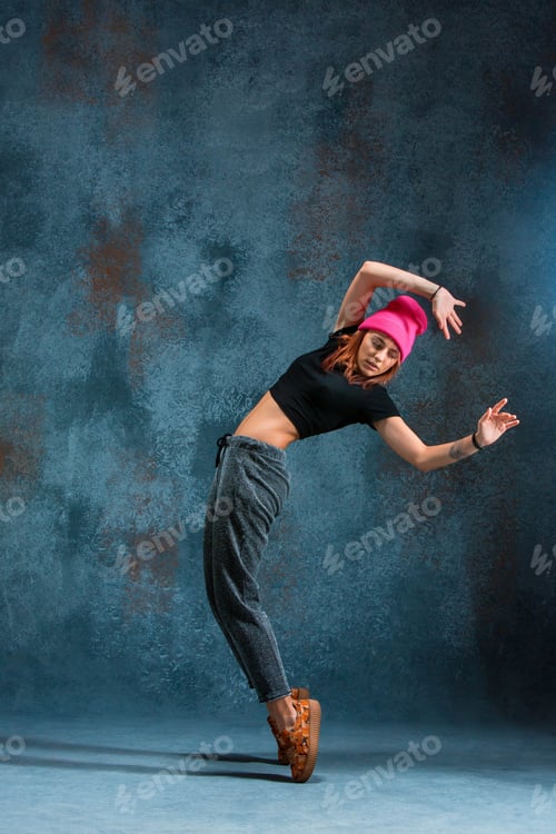 Preview: Young Girl Break Dancing On Wall Background.