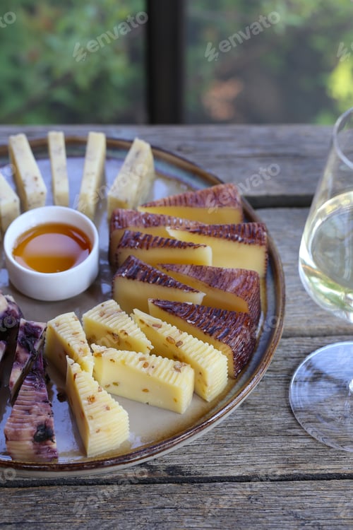 Delicious Cheese Platter with Honey and Wine