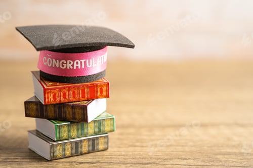 Preview: Graduation hat on book with copy space, learning university education concept.