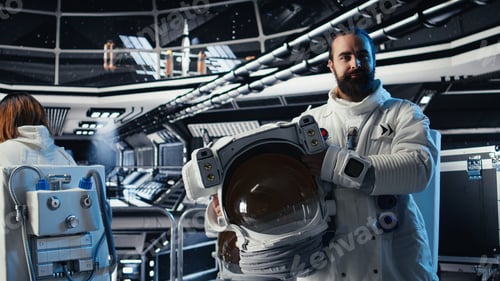 Preview: Portrait of smiling astronaut holding protection helmet