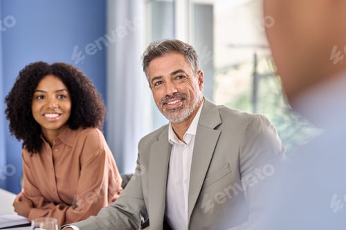 Preview: Diverse international professional executive team people at office meeting.