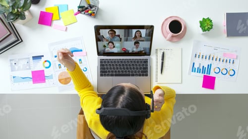 Preview: Top view of business woman talking about sale report in video conference.