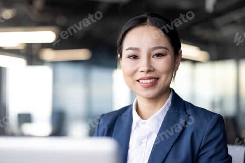Preview: Professional businesswoman smiling confidently in modern office setting