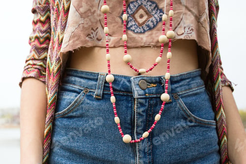 Woman in Jeans with Beaded Necklace