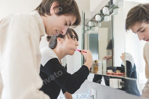 Preview: young couple brushing teeth