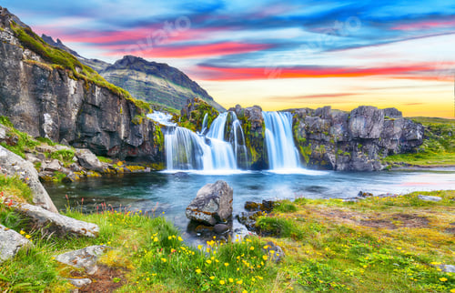 Preview: Fantastic view on Kirkjufellsfoss waterfall near Kirkjufell mountain at sunset