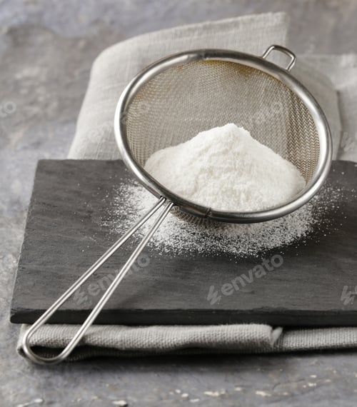Preview: Powdered Sugar in a Metal Strainer