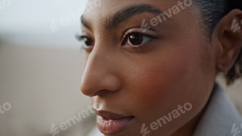 Preview: Closeup pensive woman face in blurred background. Beautiful african american