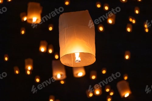 Preview: Sky lantern floating in the dark night sky, Tourist floating sky lanterns, Sky lanterns