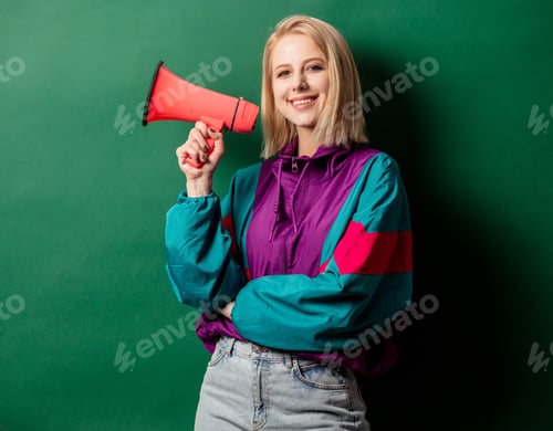 Preview: woman in 90s style punk jacket with loudspeaker on green background
