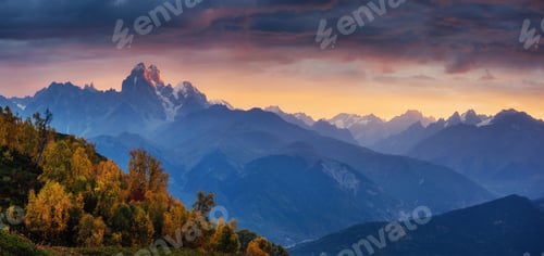 Preview: Autumn landscape and snow-capped mountain peaks. View of the mou