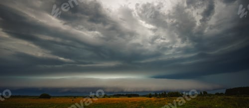 Preview: Supercell cloud with distant lightning illuminating the storm structure
