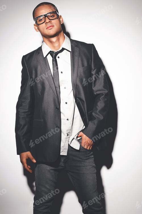 Preview: Man fashion model posing against a studio background