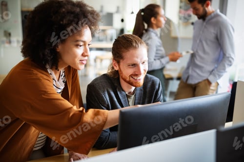 Preview: Programmers cooperating at IT company developing apps