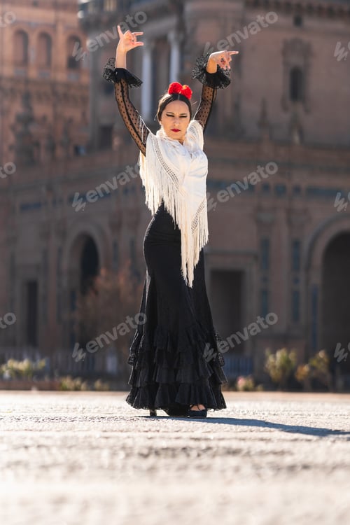 Preview: Woman in flamenco dress dancing in a square