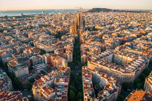 Preview: Aerial view of Barcelona Eixample residential district and Sagrada Familia Basilica at sunrise