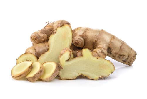 Fresh ginger root, whole and sliced