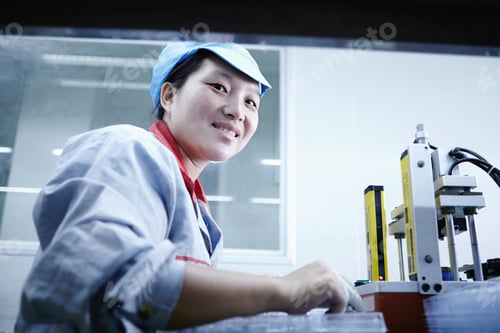 Preview: Worker at e-cigarettes battery factory, Guangdong, China