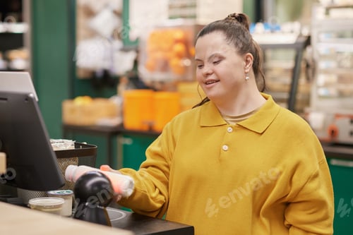Preview: Girl with Disability at Self Checkout Buying Groceries in Supermarket