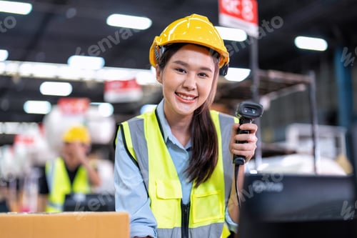 Preview: Worker working in the large depot storage warehouse happy smiling packing box at cashier counter