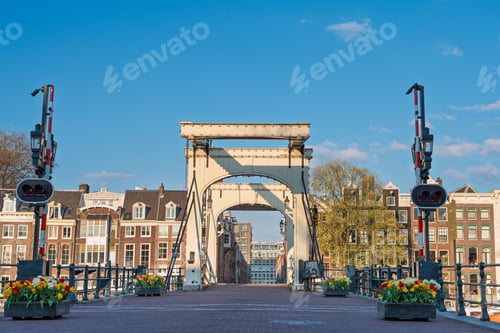 Preview: Iconic Skinny Bridge over Amstel River in Amsterdam, Netherlands. Dutch drawbridge.