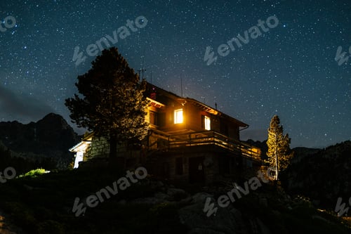 Preview: Mountain refuge at night with starry sky