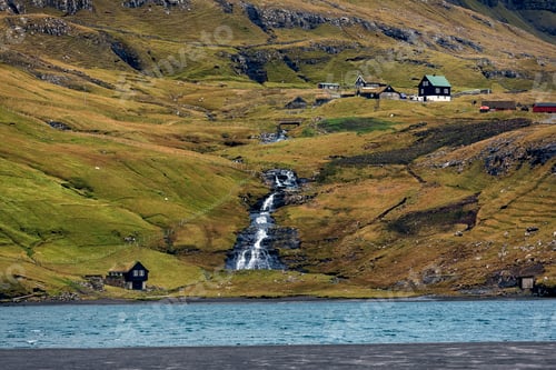 Preview: Small waterfall and small houses in small village Saksun. Streymoy, Faroe Islands. Europe