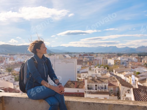 Preview: Young woman exploring historic castle in Denia