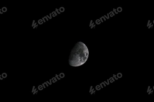 Preview: a crescent in the sky with dark clouds around it and there are no stars at