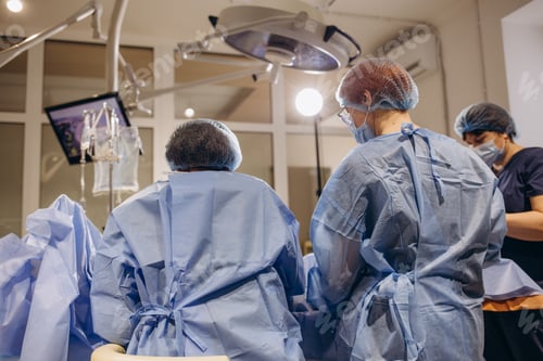 Preview: doctor and an assistant in the operating room for surgical venous vascular surgery clinic
