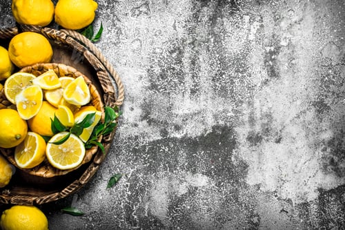 Preview: Fresh lemons on a tray.