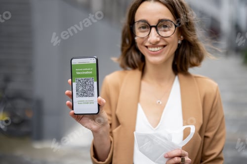 Preview: Woman show phone with Coronavirus Vaccination app