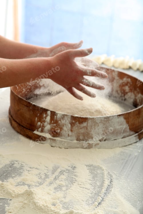 Preview: chef sifting flour for bread making