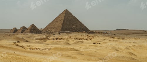 Preview: Desert landscape showcasing distant pyramids in Giza, Egypt