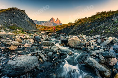 Preview: Landscape of iconic three peak and waterfall flowing of Aiguilles d'Arves in French alps