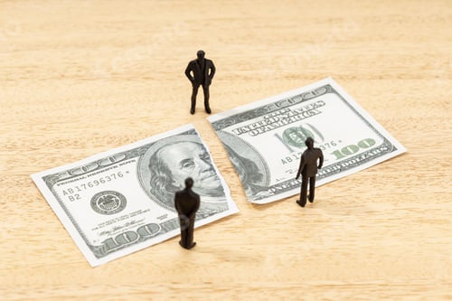 Preview: Fake torn dollar banknote and human figurines on wooden table